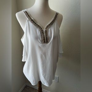 A beautiful white top with cut out shoulders